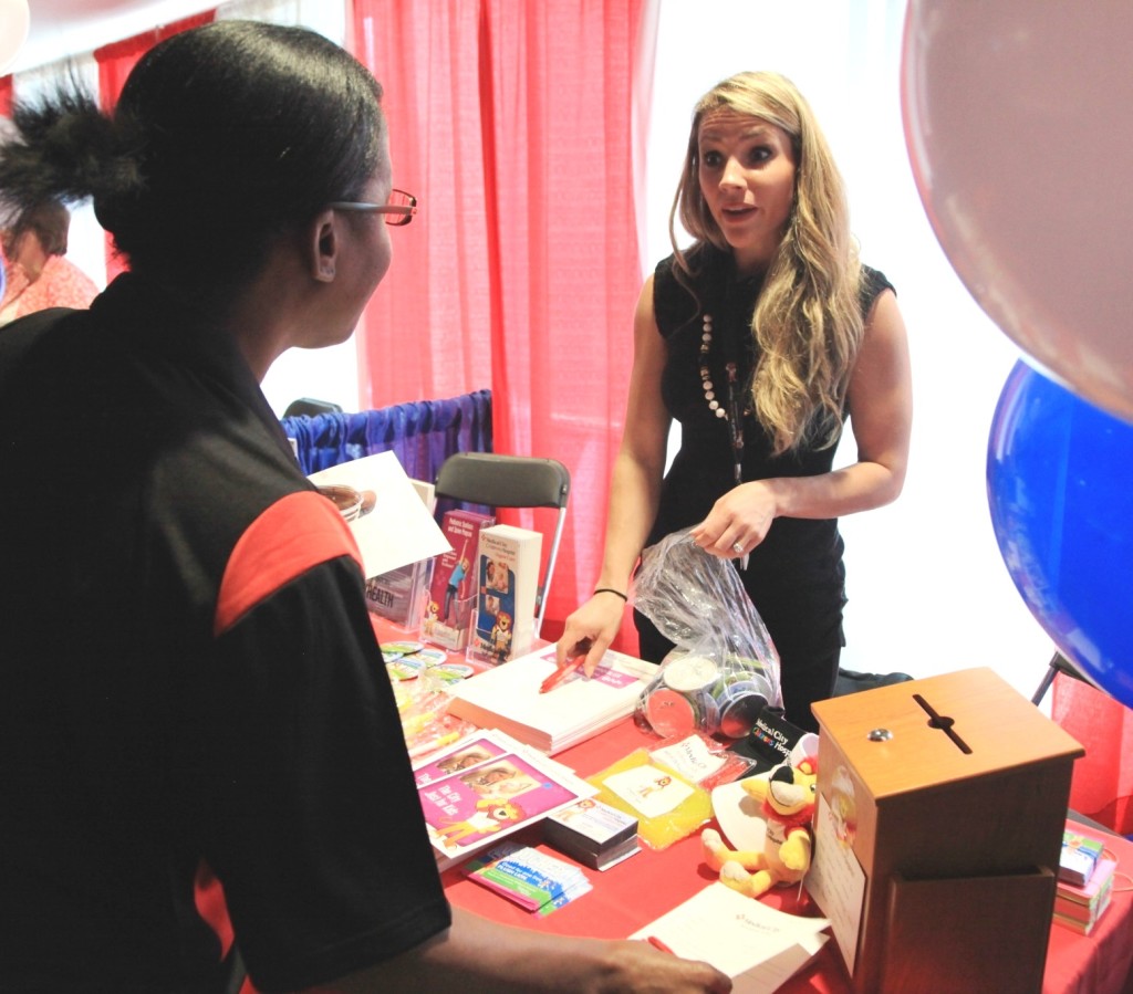 Photo: Rachael Evans An associate gets some advice at the Health & Wellness Fair on Friday in Dallas.