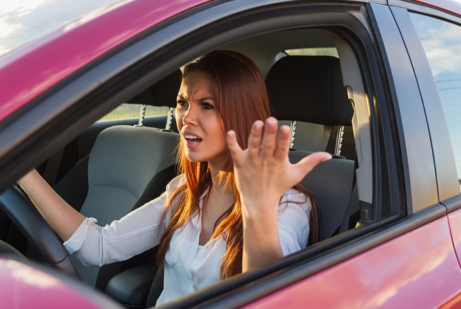 woman-in-car-with-hands-out