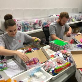 SC volunteers provide helping hands to pack M.A.G.I. boxes for kids
