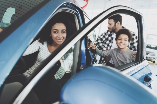 Family with new car