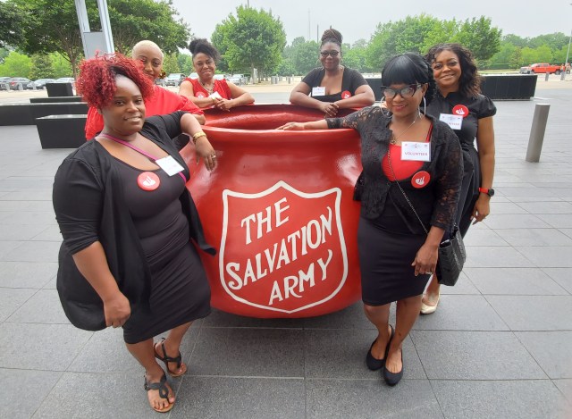 Salvation Army kettle with volunteers