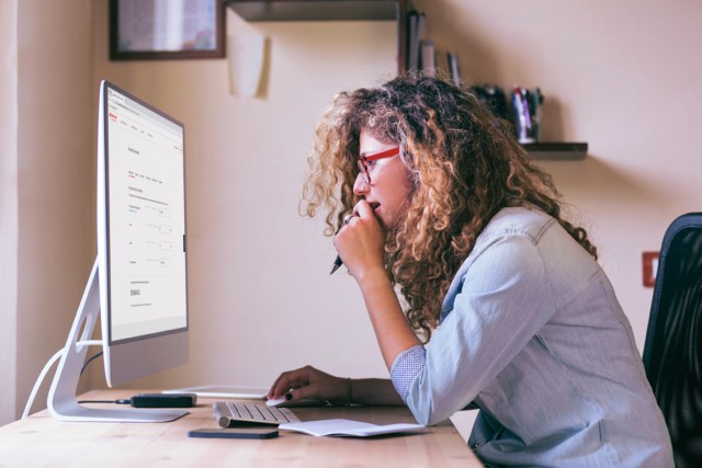 woman looking at auto finance calculator