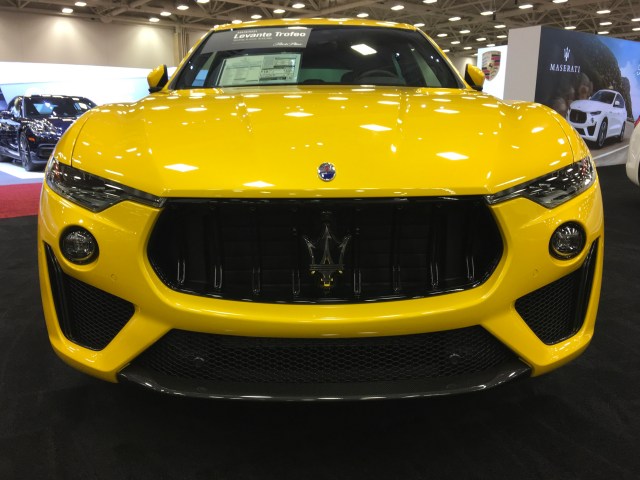 Yellow Maserati at auto show near me