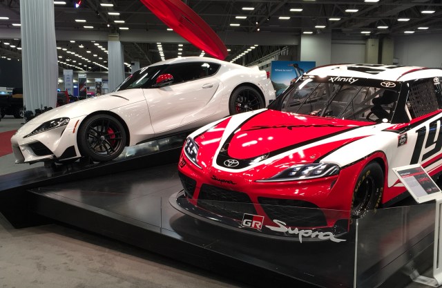 Two Toyota Supras at auto show near me