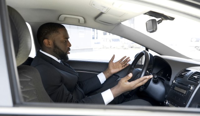 Frustrated man annoyed with bad drivers