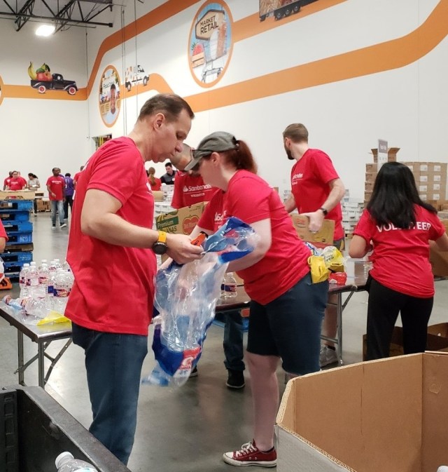 Volunteers working assembly line