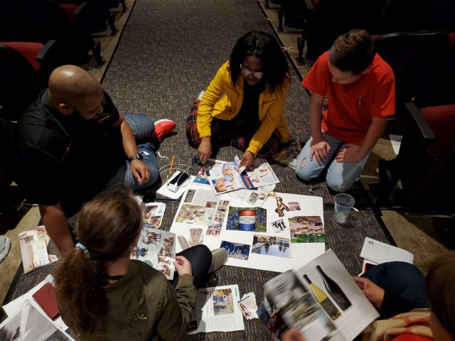 Volunteers and students work on vision boards