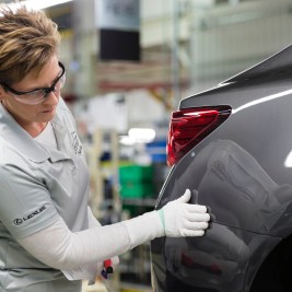 Woman inspecting Lexus ES on production line
