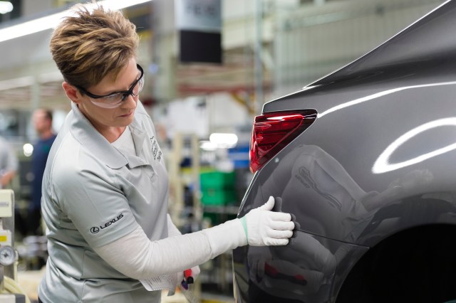 Woman inspecting Lexus ES on production line