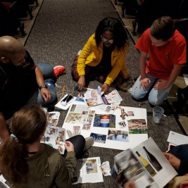 Volunteers and students work on vision boards