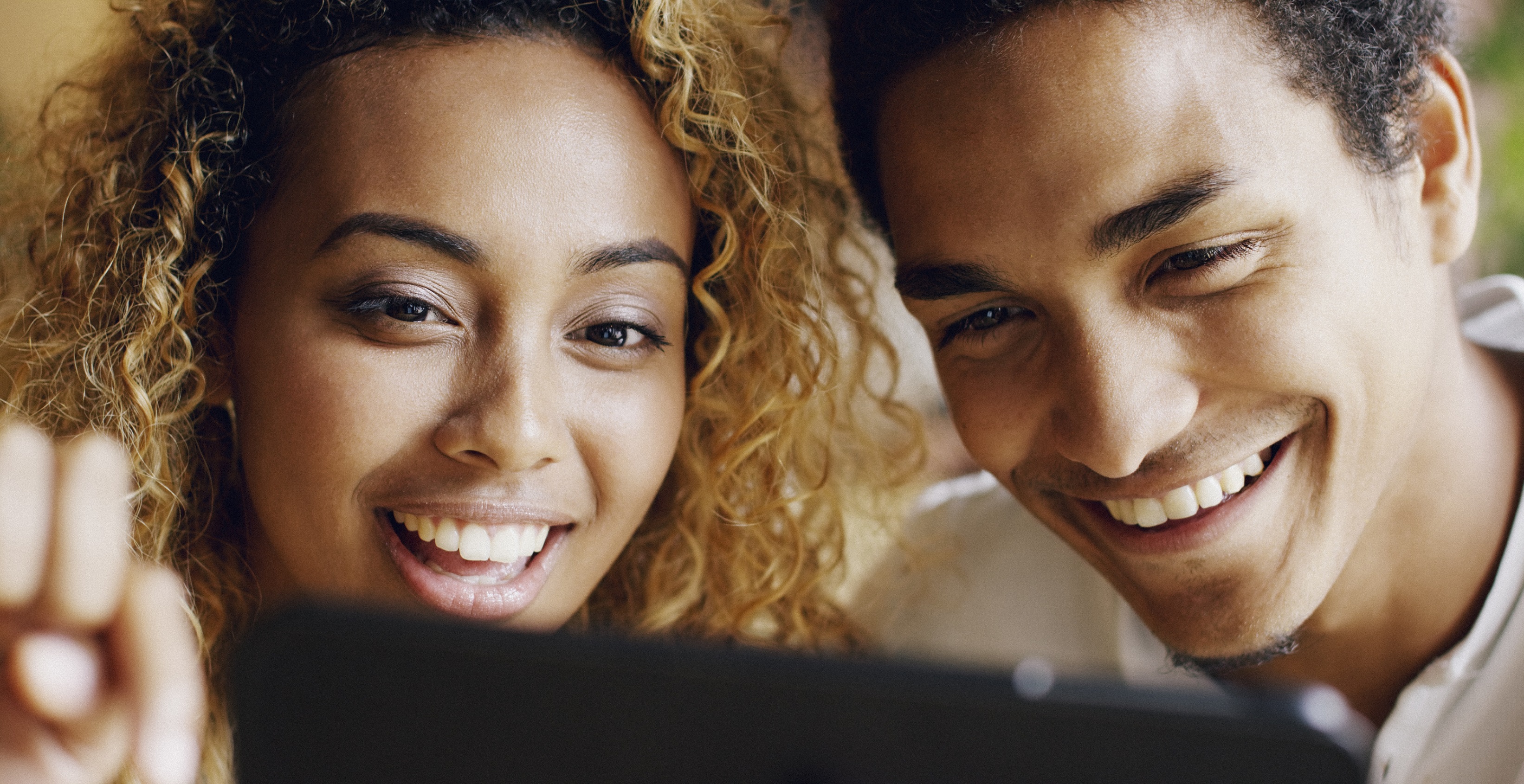 Smiling couple looking at computer