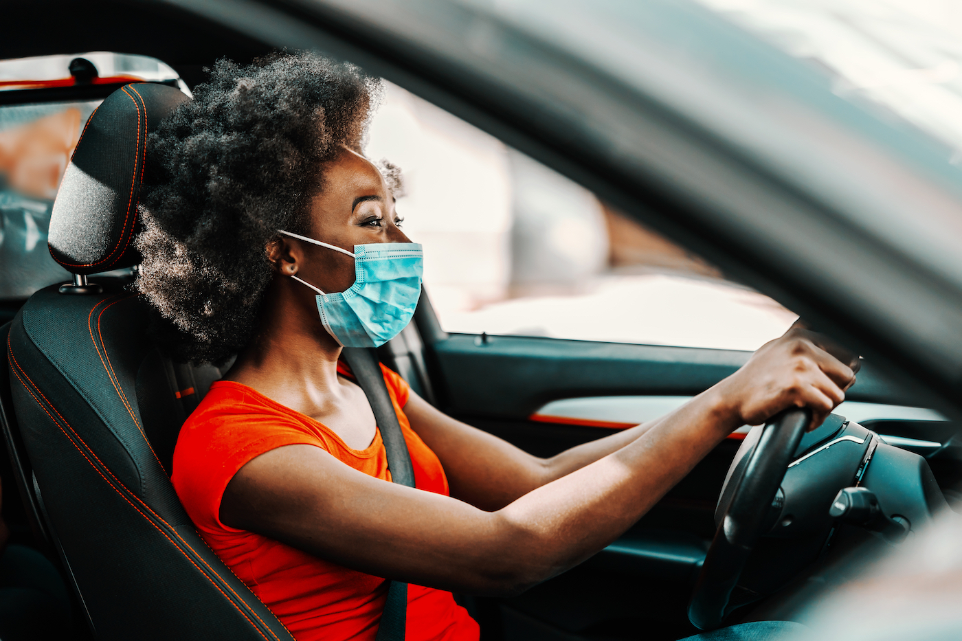 Woman sitting in new car