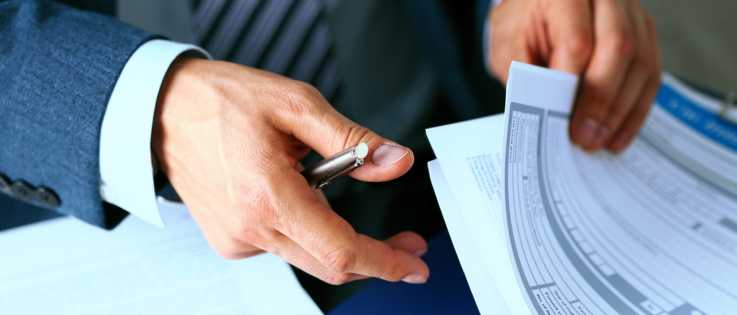 Dealer looking at paperwork