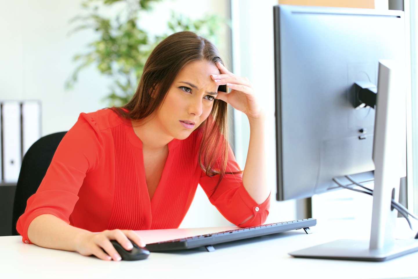 People looking at computer with surprised faces