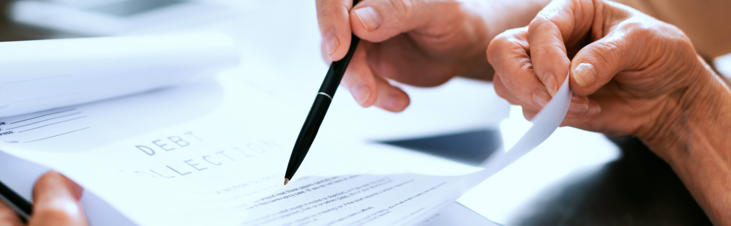 Couple reviewing debt collection paperwork