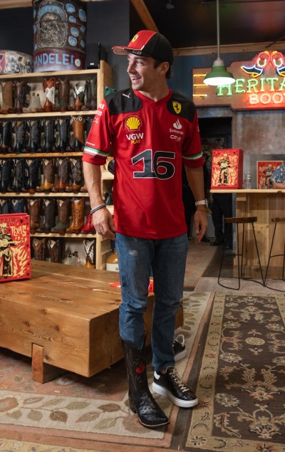 Scuderia Ferrari Driver Charles Leclerc tries on his new Santander-branded custom boots.